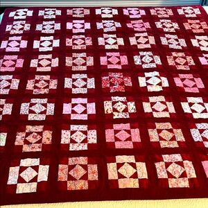 Elegant Cranberry and Pink Patchwork Quilt